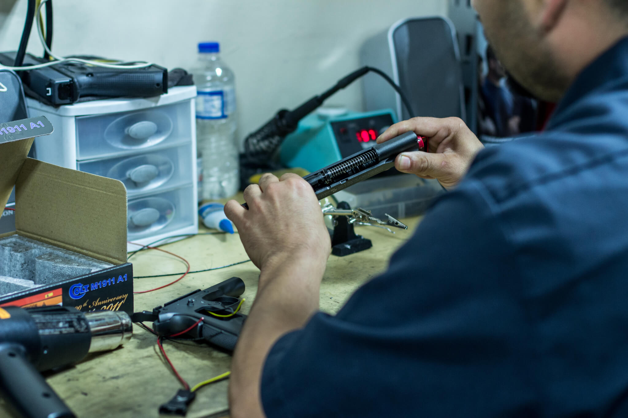 Laser Shot engineers working on simulated pistols